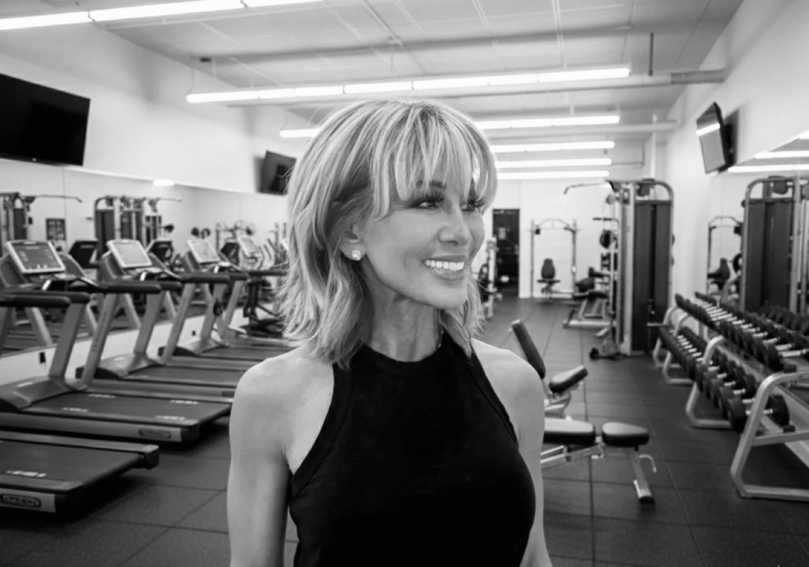 Kim Fisher on the gym floor, black and white
