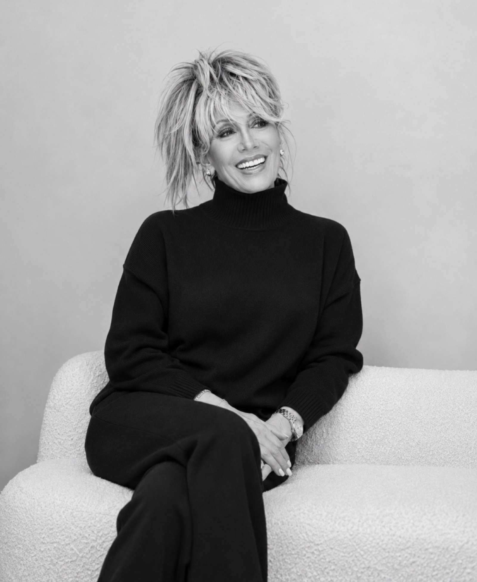 Kim Fisher, black and white portrait in a turtleneck